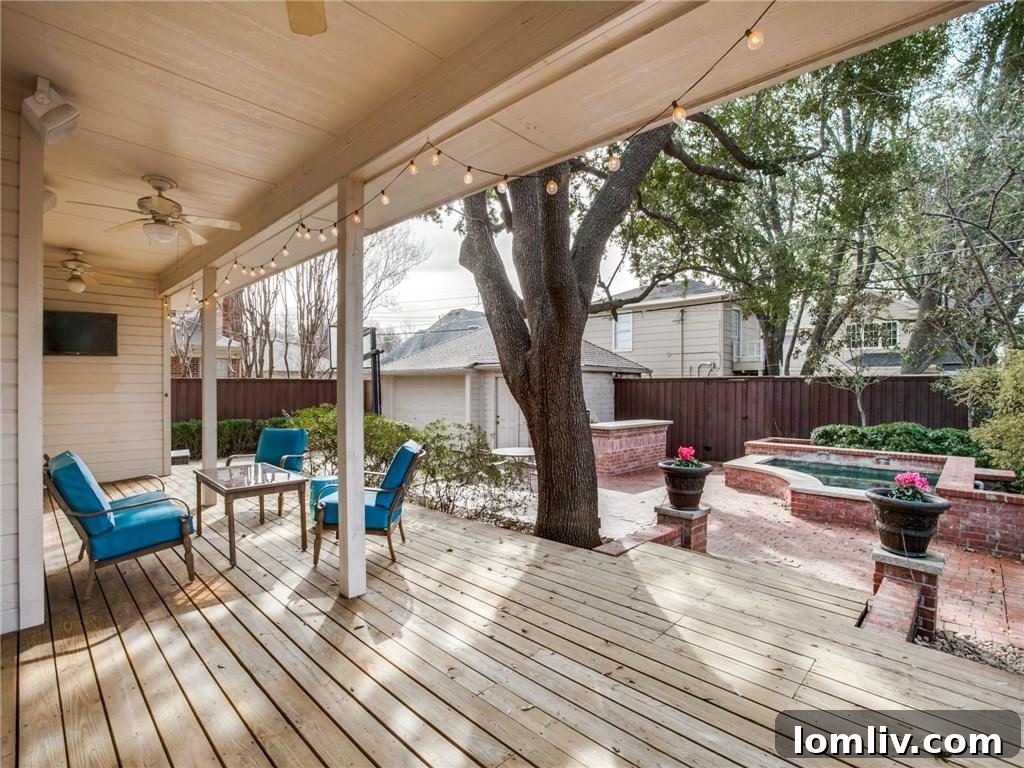 Expansive Backyard Entertainment Area with Covered Porch