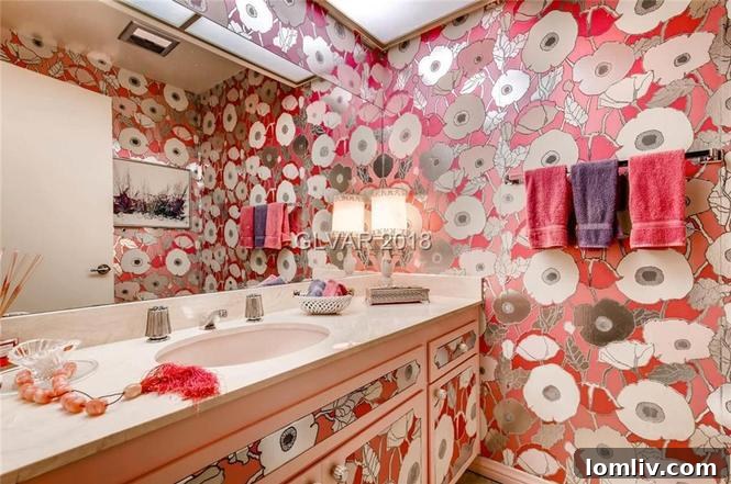 Bathroom with distinctive poppy-patterned wallpaper and vintage fixtures