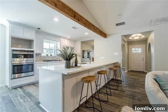 Modern kitchen with quartz countertops and stainless steel appliances