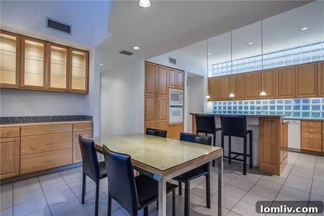 Large kitchen with ample cabinetry and island for meal prep