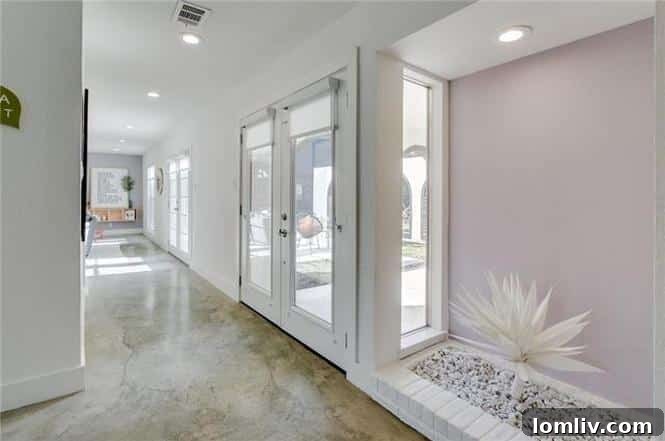 Open concept living area with polished concrete floors and modern decor