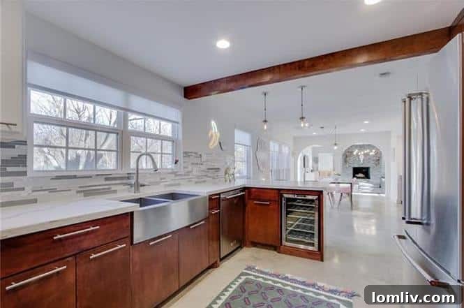 Stylish kitchen with stainless steel appliances and quartz countertops