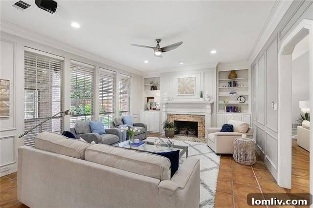 Bright and airy living room with fireplace and built-in bookshelves