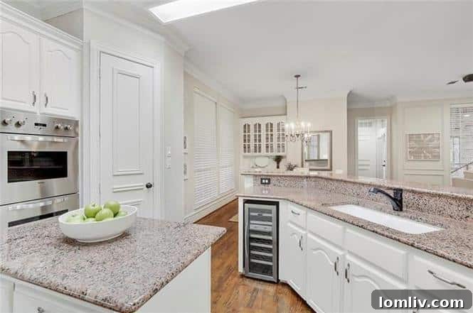 Luxurious master bathroom with separate vanities and garden tub