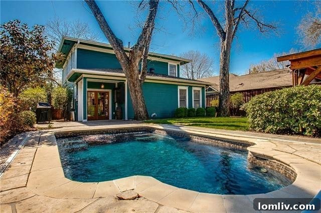 Inviting swimming pool and covered patio in the private backyard of 6005 Bryan Parkway