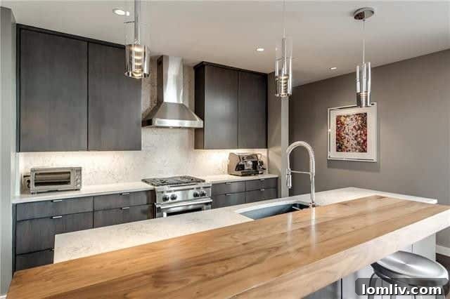 Modern kitchen with large island and stunning city views through NanaWall folding doors