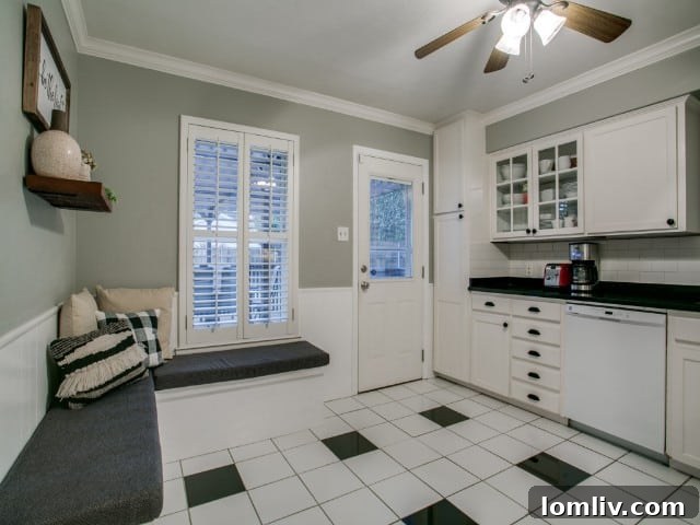 Spacious and bright kitchen interior with view towards dining area, complemented by gleaming hardwood floors, L Streets Dallas