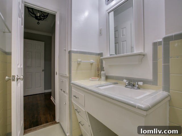 Detailed view of the sleek, modern walk-in shower in the updated master bathroom, a highlight of this Dallas home