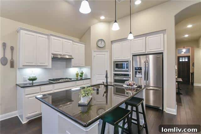 Euless: Where Close-Knit Sundays Define Ideal Suburban Living 15 Dining area leading to living room at 1415 Huntsman Ridge Lane