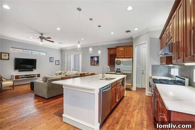 Modern condo kitchen with large island and quartz countertops