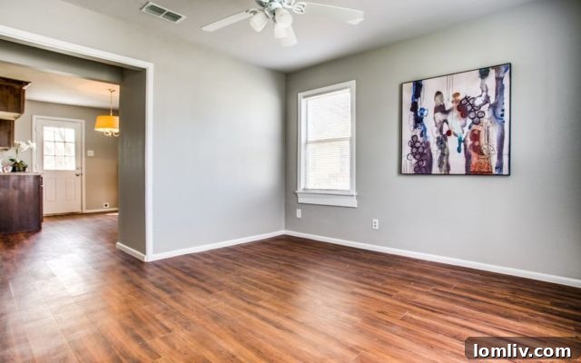 Bright and airy living area featuring hardwood floors and an open concept layout.