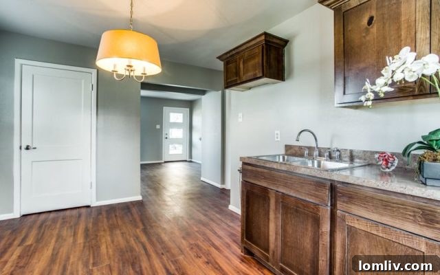 Modern kitchen with wood cabinetry and an eat-in breakfast nook, perfect for casual dining.