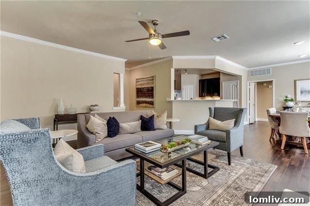 Modern kitchen with dark cabinetry, granite countertops, and stainless steel appliances in Unit 516