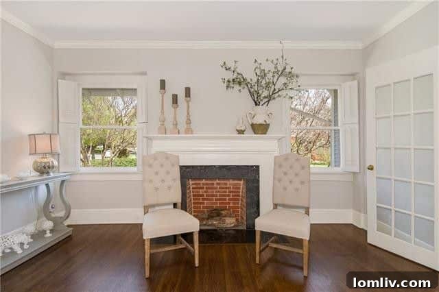 Bright living area with classic archways in a Winnetka Heights Craftsman home