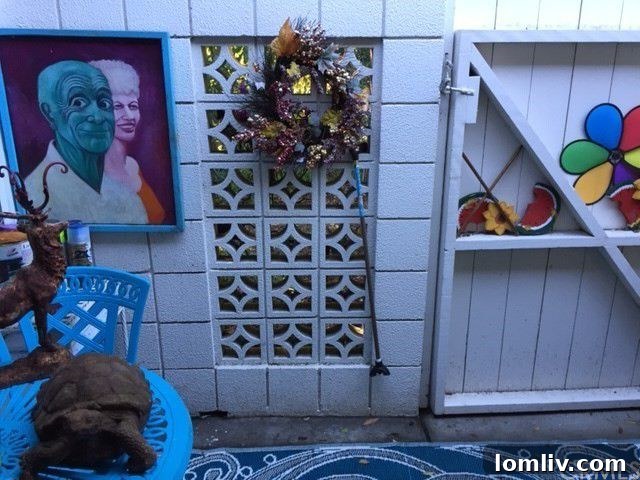 Grinning old people statues on a patio, adding to the bizarre decor of the Laguna Woods condo
