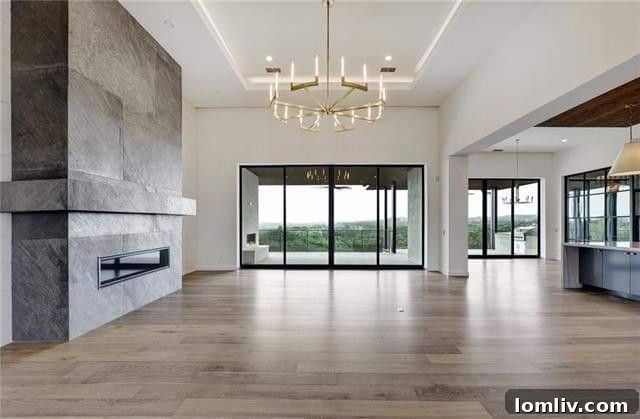 Elegant dining area with modern chandelier and view of the golf course