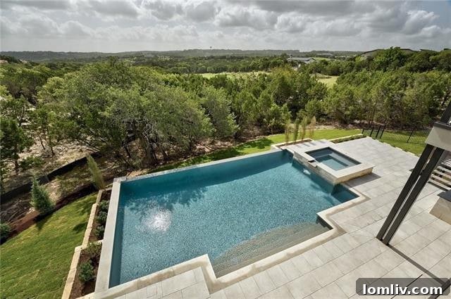 Expansive outdoor entertainment area with custom bar and seating