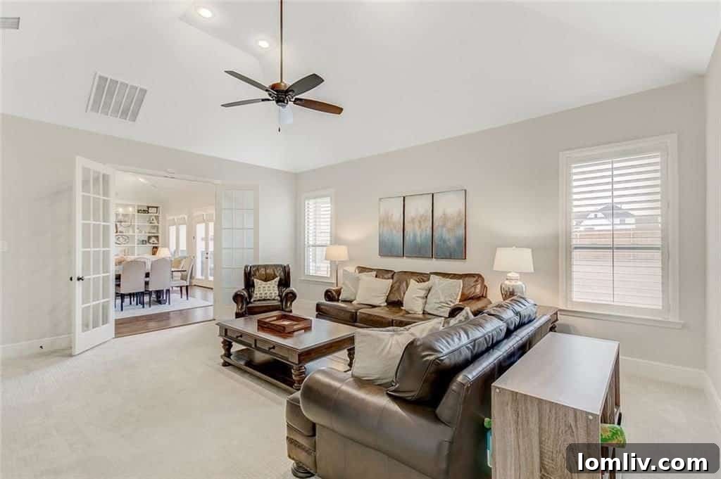 The private and versatile media room or den at 612 Rockledge Court, conveniently located off the open kitchen and living area.