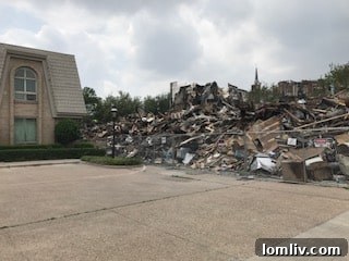 Large pile of debris from the Preston Place fire next to Diplomat Condos
