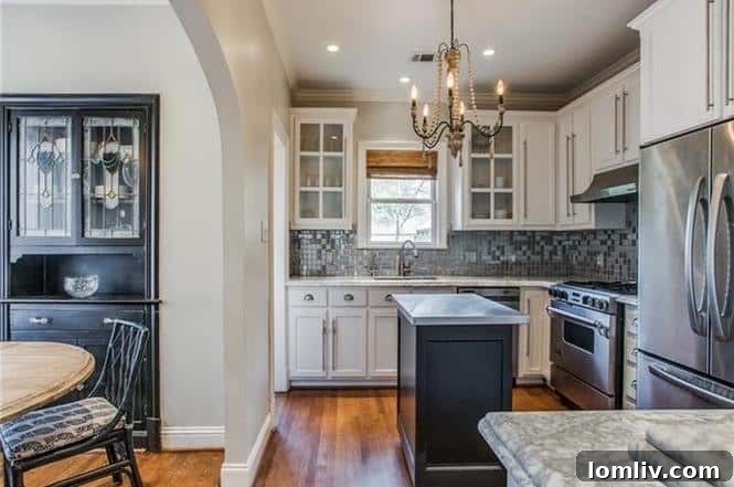 Gourmet kitchen with marble countertops and stainless steel appliances