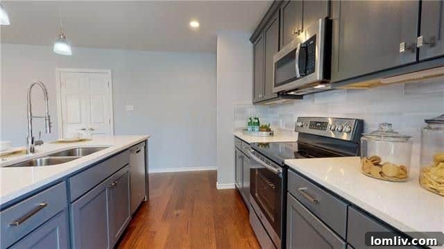 Modern kitchen with quartz countertops in Oak Cliff Tudor home