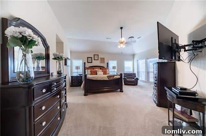 Luxurious master bathroom with separate vanities and garden tub