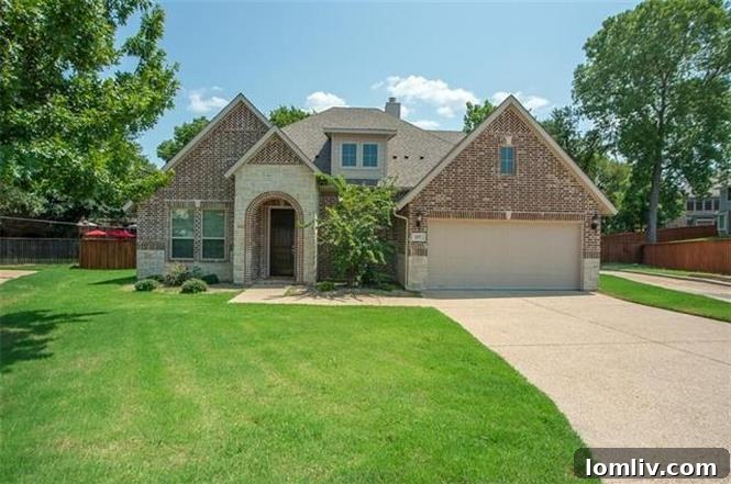 Stunning exterior of a brick and stone home in a gated community
