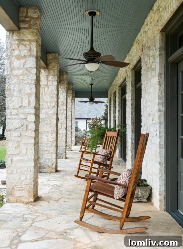 Elegant entryway of a Southlake luxury home with wooden double doors and high ceilings
