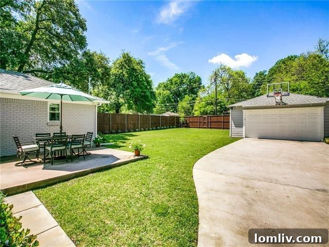 Expansive fenced backyard with mature trees, offering privacy and space for recreation