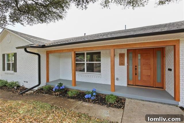 Front exterior of Caruth Meadows ranch home with lush landscaping