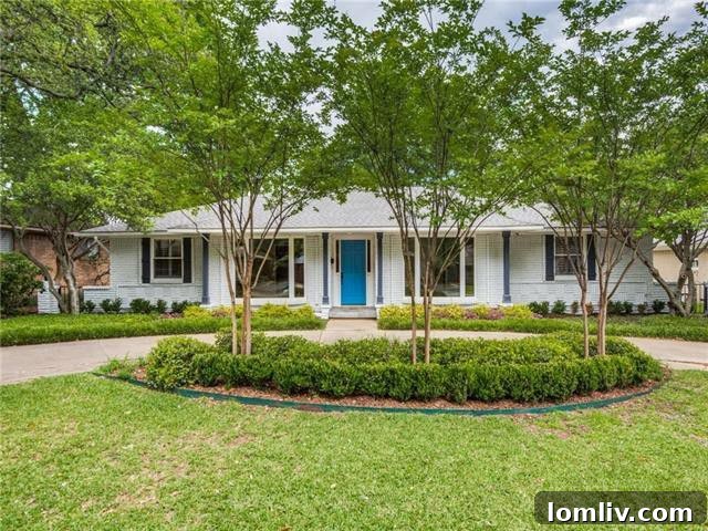 Elegant front exterior of 5603 Ledgestone Drive with a distinctive circle drive and mature trees