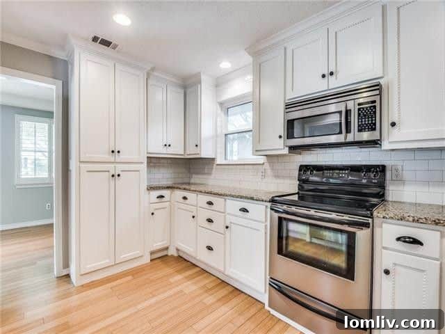 Contemporary kitchen with updated appliances, granite countertops, and breakfast nook