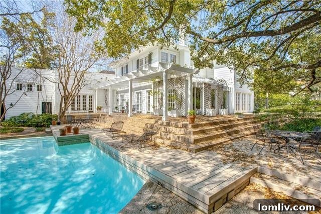 Rear view of the elegant 3503 Crescent Avenue Colonial home with pool