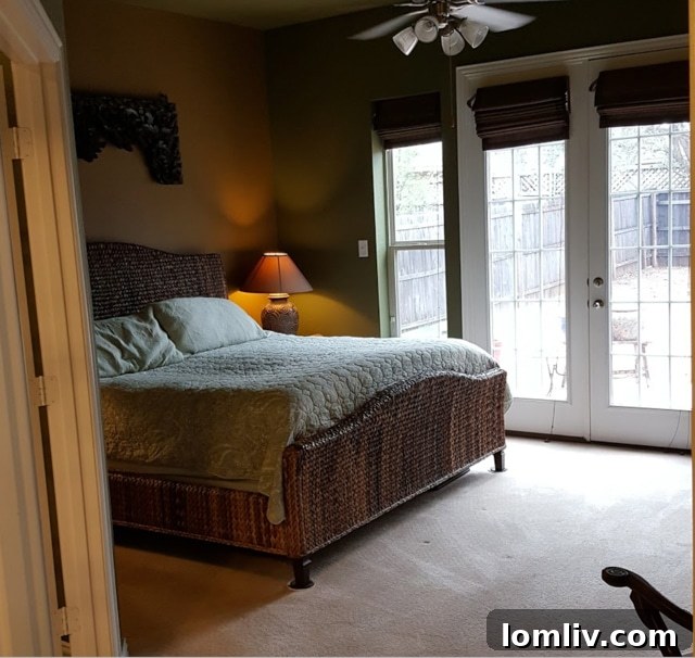 Before Renovation: Bedroom with old, dated paint color