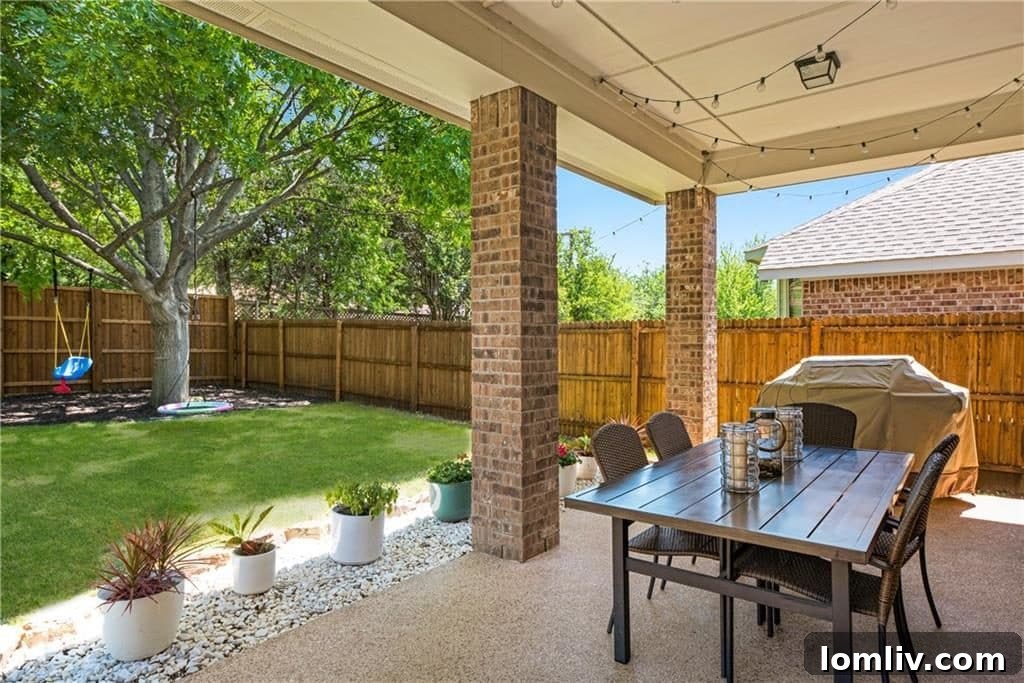 Welcoming entryway of the East Dallas home with landscaping