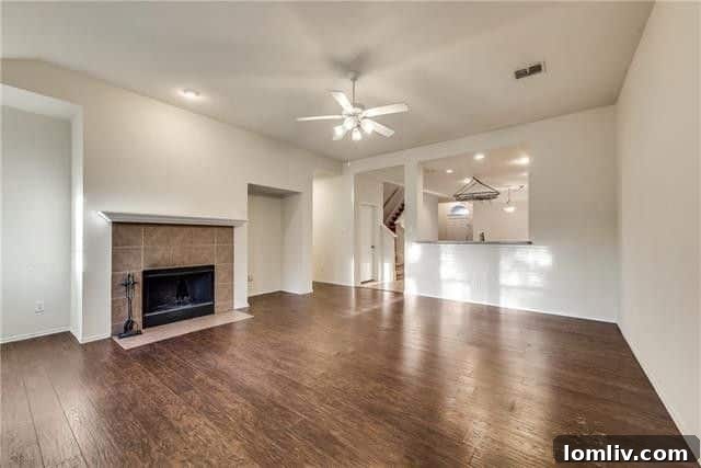 Cozy living room with dark wood floors and fireplace
