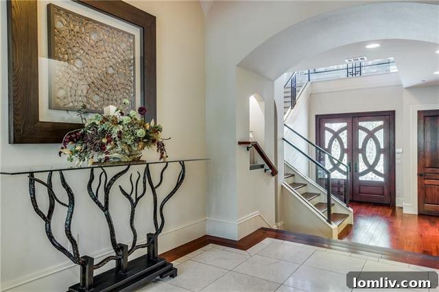 Elegant Entryway with Onyx Floor and Backlit Art in Southlake Luxury Home