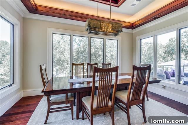 Dining Area with Three Walls of Windows Overlooking Trees