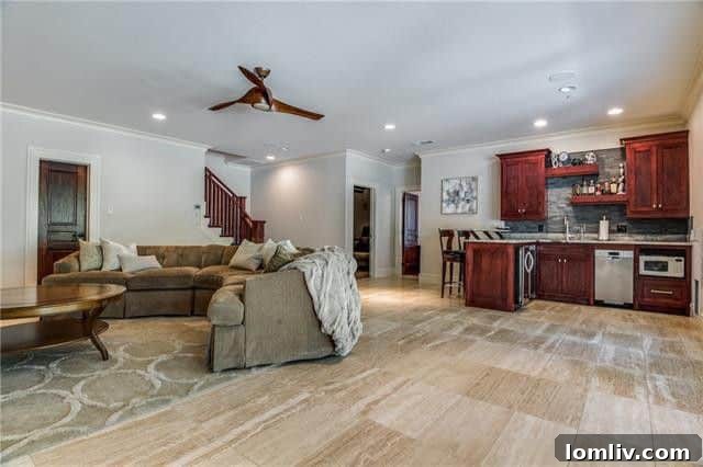 Luxury Walk-Out Basement Living Area with Bar and Limestone Floors