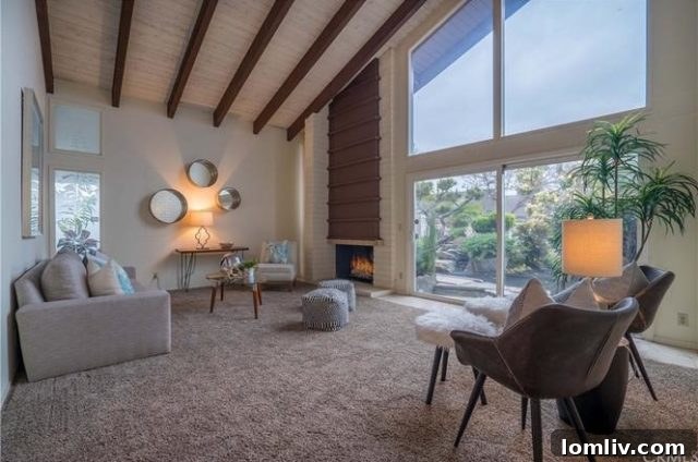 A modern living room with large windows, bright and airy.