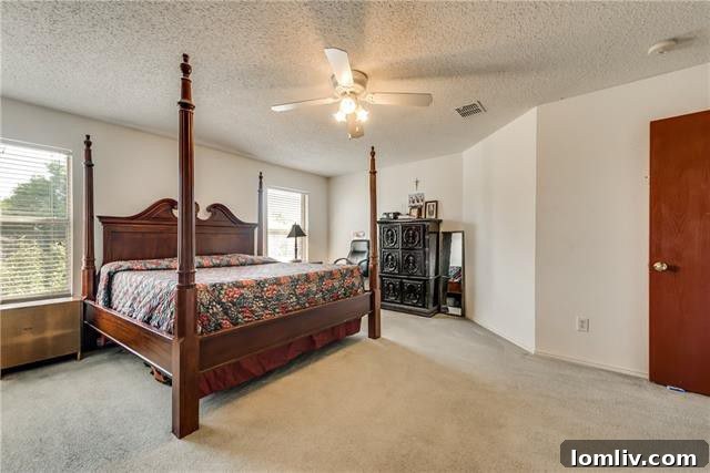 Bright and airy upstairs living area, perfect for a media room or play space at 2824 Quail Run Drive
