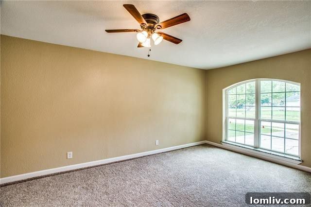 Bright dining area with large windows at 3407 Palm Drive, overlooking the backyard