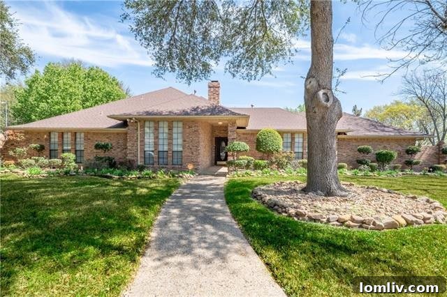 Exterior view of 4505 Ivy Drive, a stately brick home with a large front yard in Mesquite