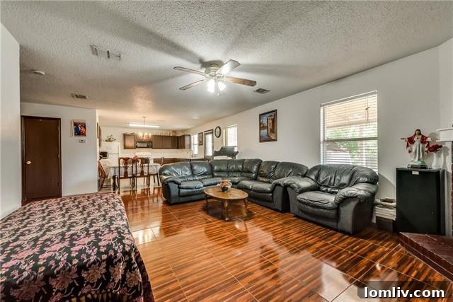 Spacious downstairs living room with abundant natural light at 2824 Quail Run Drive