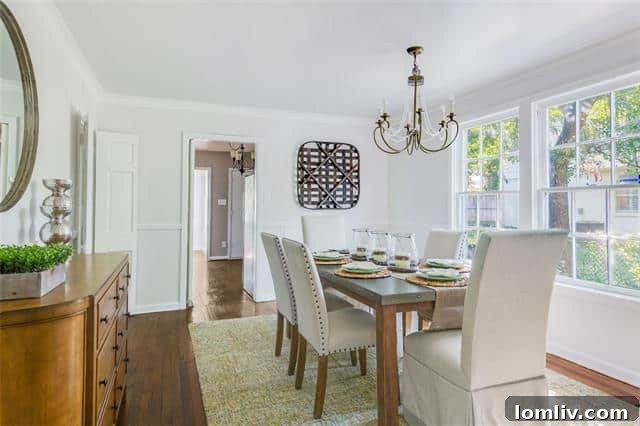 Bright Living Room with Wood-Burning Fireplace and Oak Floors in Monticello Cottage