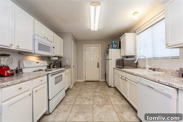 Well-Maintained Galley Kitchen and Dining Area