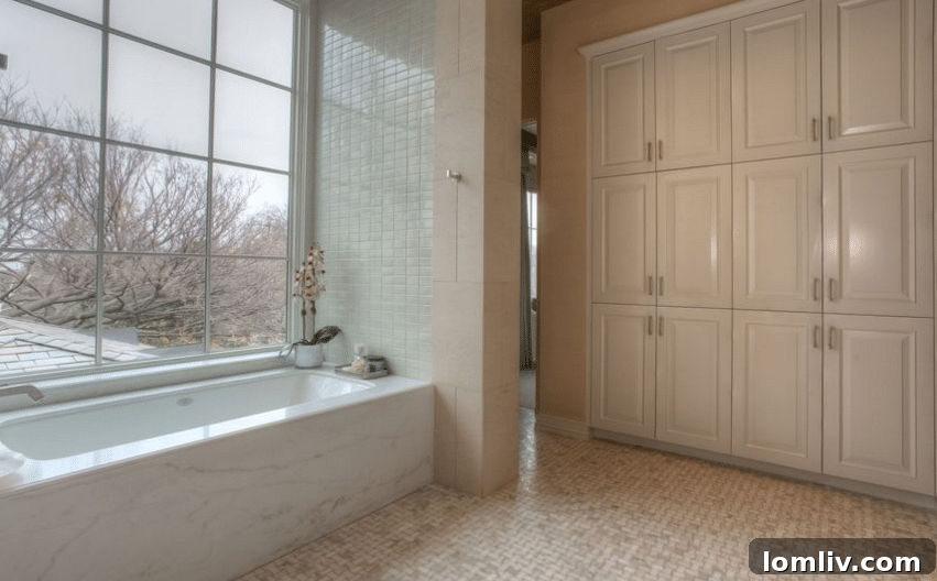 Luxurious Master Bathroom with Dual Sinks and Marble Tub