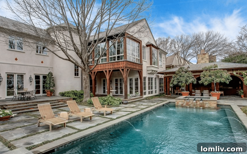 Luxury Outdoor Pool with Waterfall and Entertainment Area