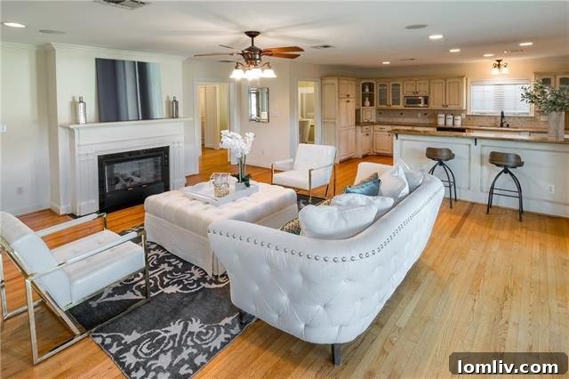 Inviting living room with hardwood floors and fireplace in the Devonshire family home