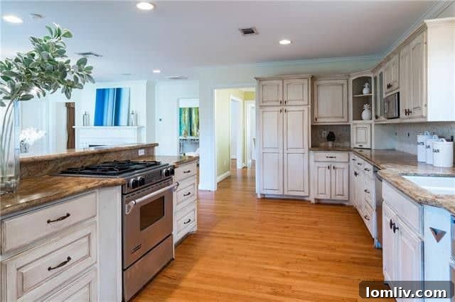 Updated kitchen with granite countertops and stainless steel appliances at 5651 Purdue Avenue